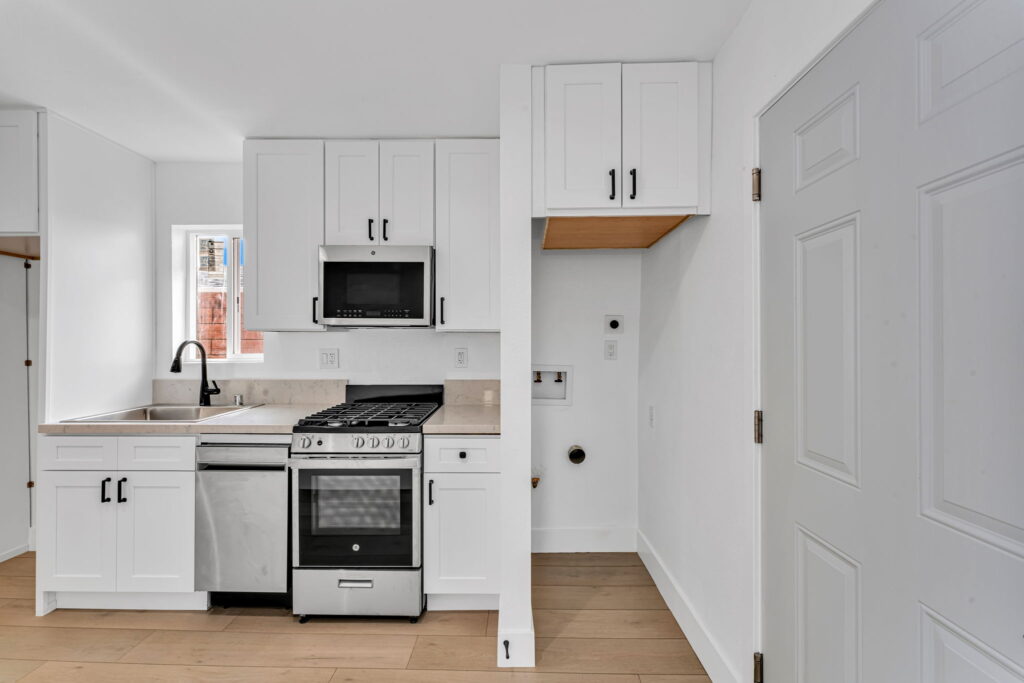New ADU kitchen with white shaker cabinets in Spring Valley CA by PBH Builders