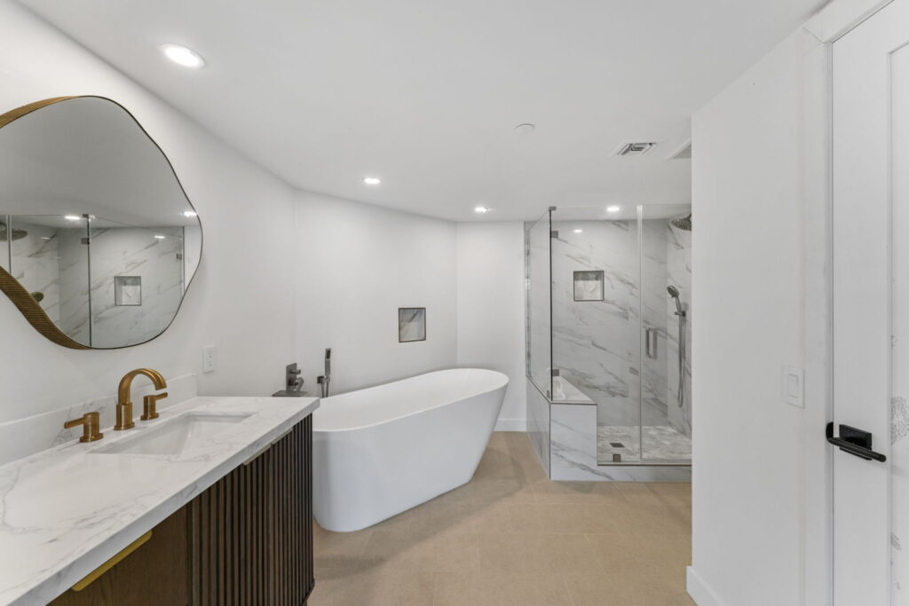 Spa bathroom remodel with freestanding tub and double vanity in downtown San Diego
