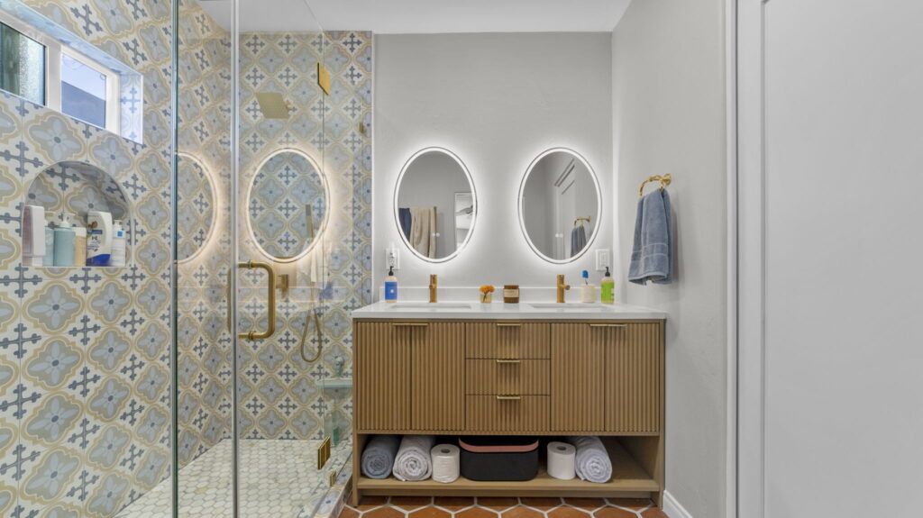 Designer bathroom remodel with Moroccan patterned tile and gold fixtures in North Park San Diego