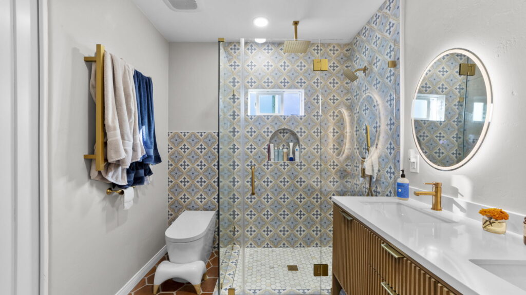 Patterned tile shower with brushed gold hardware, bathroom remodeling San Diego