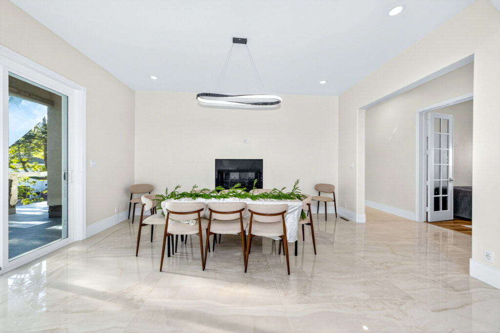Whole home remodel in Escondido CA - open dining room with designer chandelier by PBH Builders