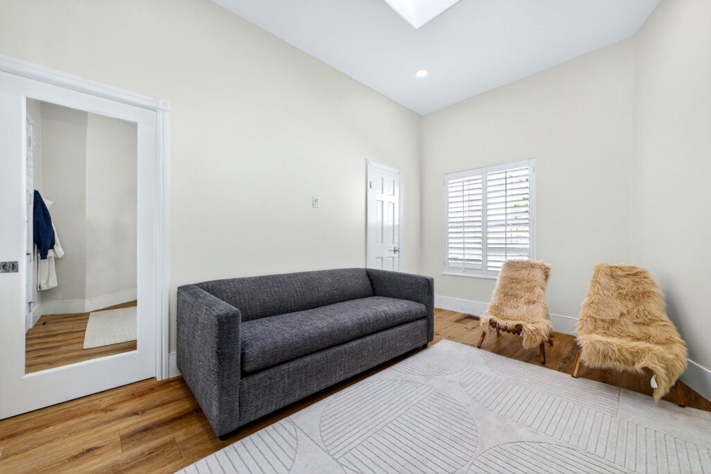 Remodeled family room with polished flooring and natural light in Escondido CA