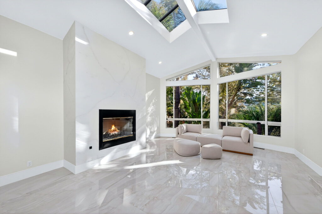 Bright living room with modern fireplace, whole house remodel in San Diego County