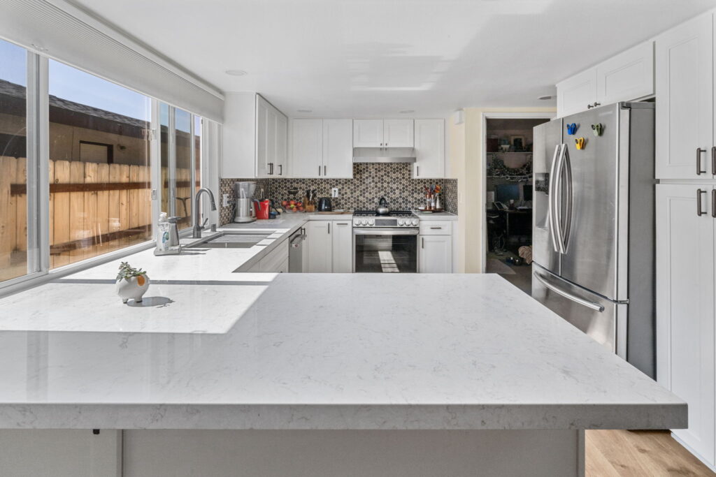 Kitchen renovation with quartz countertops and stainless appliances by PBH Builders