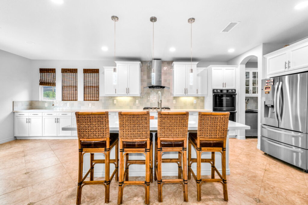 Kitchen remodeling in Chula Vista with large island, pendant lighting and bar seating