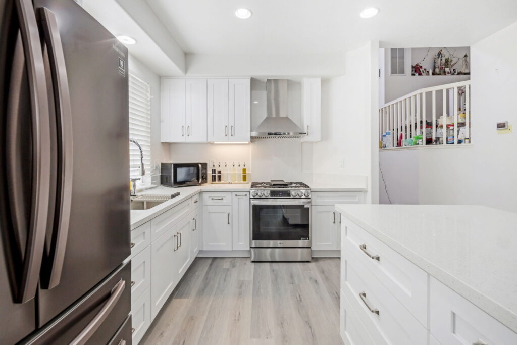 Kitchen remodeling in Chula Vista with white shaker cabinets and slate appliances