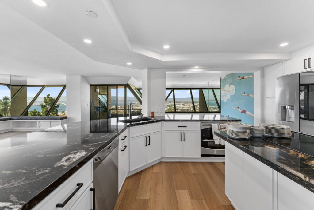 Luxury high-rise kitchen remodel in downtown San Diego with black granite countertops and city views