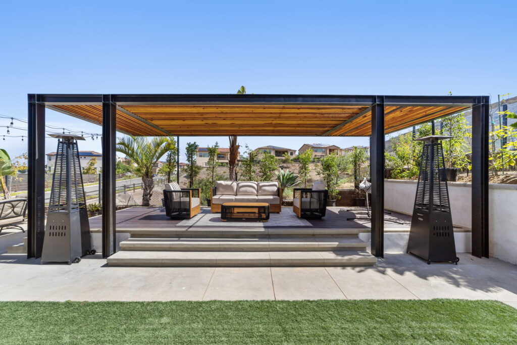 Modern pergola with lounge seating, outdoor living space construction in San Diego by PBH Builders